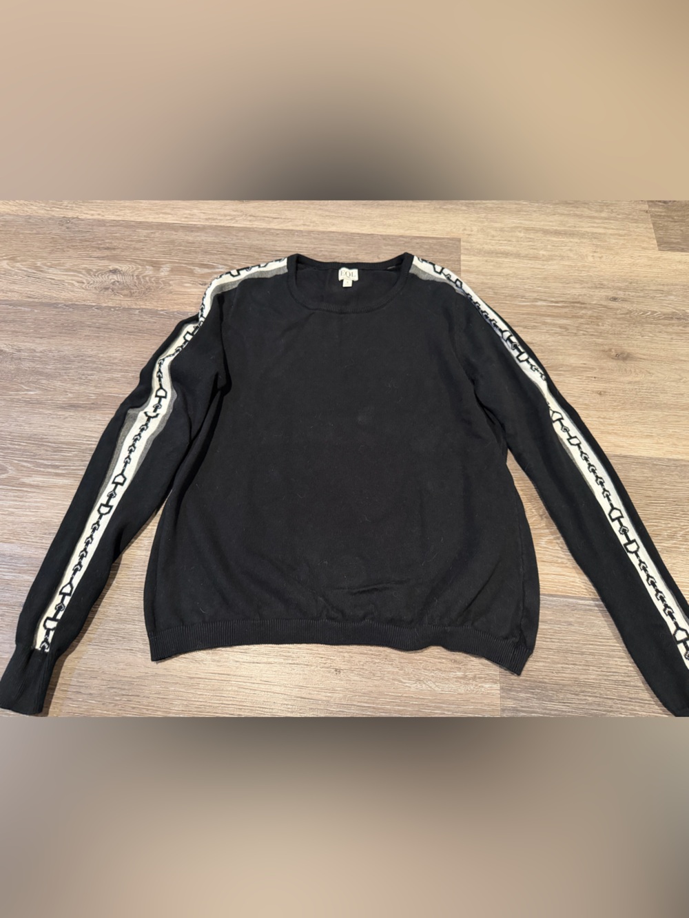EQL equestrian sweater with a ‘bit’ chain from top to bottom
